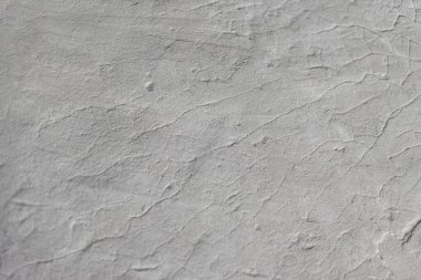 Pankart. Eski çatlamış kuru beyaz kil yüzeyi. Bir yazı için beton arka plan. Boşluğu kopyala.