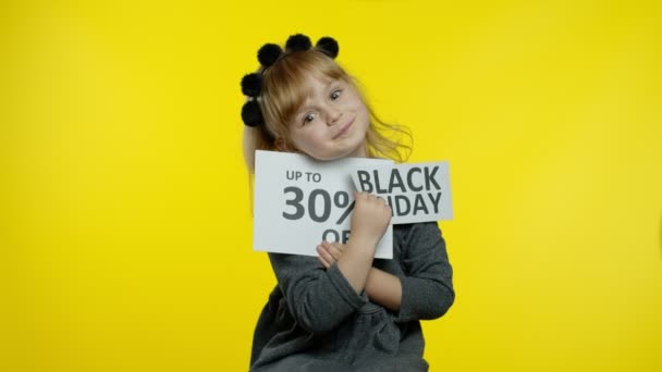 Child kid girl showing Black Fridayand Up To 30 Percent Off discount advertisement inscriptions text — Stock Video