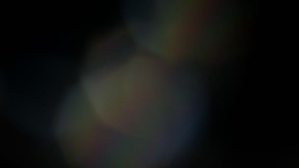 Multicolored light leaks 4k footage on black background, lens studio flare leak burst overlays — Stock Video