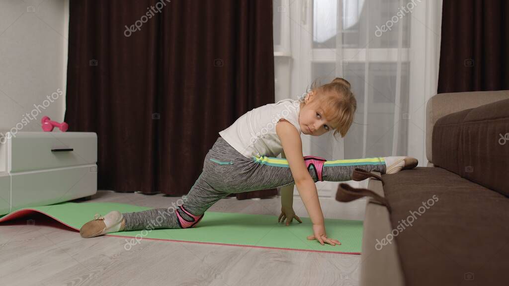 Fit Little Child Kid Training Gymnastics Fitness Twine Stretching Workout On Sofa Healthy Lifestyle Active Leisure At Home Children Girl In Sportswear Making Sport Exercises Warming Up Cardio Larastock
