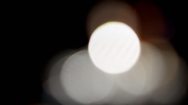 Projeler için ışık sızıntısı 4K görüntü, optik parlaklık lensi bokeh geçiş arkaplanı örtüyor