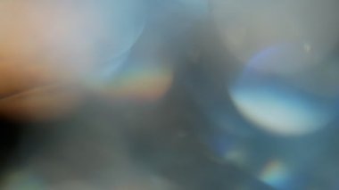 Projeler için ışık sızıntısı 4K görüntü, optik parlaklık lensi bokeh geçiş arkaplanı örtüyor