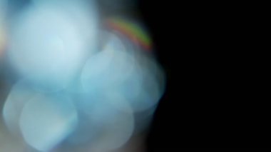 Projeler için ışık sızıntısı 4K görüntü, optik parlaklık lensi bokeh geçiş arkaplanı örtüyor