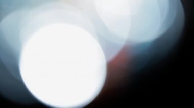 Projeler için ışık sızıntısı 4K görüntü, optik parlaklık lensi bokeh geçiş arkaplanı örtüyor