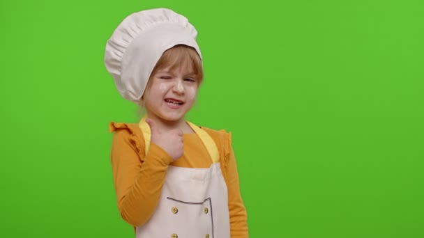 Child girl dressed cook chef baker in apron and hat showing thumbs up, fooling around on chroma key — Stock Video