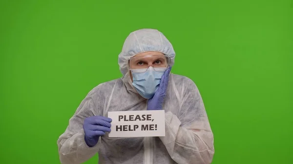 Doctor in PPE suit with text inscription - Please, Help Me n chroma key, coronavirus pandemic