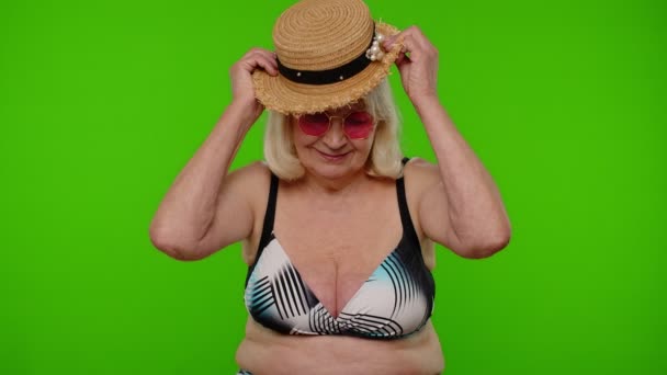 Senior woman tourist in swimsuit wearing hat, waving hands hi hello welcome greetings on chroma key — Stock Video