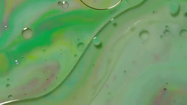 Bunte grüne gelbe Blasen Oberfläche Tapete Themen Hintergrund, mehrfarbige Raum Universum Konzept — Stockvideo