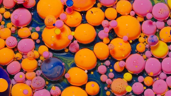 Colorful orange pink bubbles surface wallpaper themes background, multicolor space universe concept