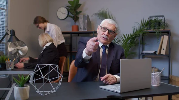 Senior mature old business man pointing to camera, choosing lucky one winner, meaning we need you