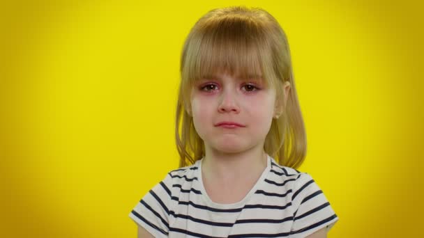 Disappointed upset kid child girl with tears on eyes cries from despair sad because of unfair things — Stock Video