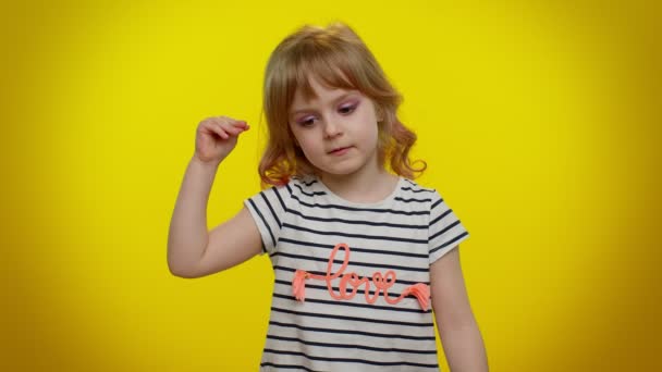Displeased blonde kid child showing nonsense gesture with hands, gossips, empty promises, lier — Stock Video