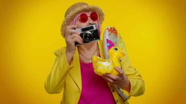 Senior woman granny tourist photographer taking photos on retro camera, travel, holiday vacations — Stock Video