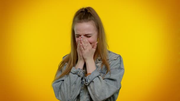 Upset disappointed girl wipes tears and cries from despair, being sad because of unfair things — Stock Video