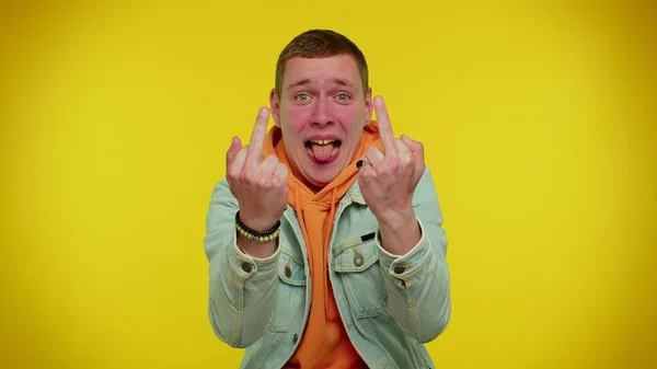 Aggressive crazy hooligan man showing around his middle fingers, impolite rude gesture of disrespect — Stock Photo, Image