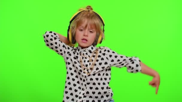 Funny playful blonde child kid listening music via headphones dancing disco fooling having fun party — Stock Video
