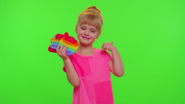 Child girl holding many colorful squishy silicone bubbles pop it popular sensory toys, thumb up — Stock Video