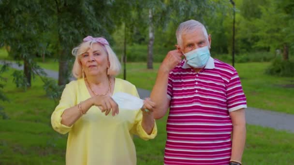 Quarantine Coronavirus is over, senior old family grandparents take off medical masks, celebrate — Stockvideo