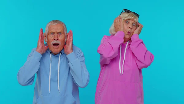 Stressed depressed senior grandparents expresses their fear and waves hands away from danger, no — Stock Photo, Image