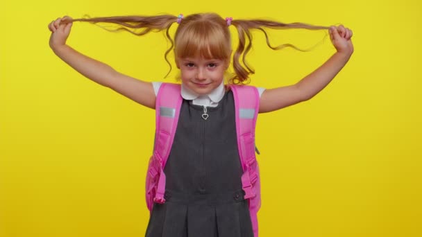 Smiling schoolgirl play with pony tails laugh fooling around making playful silly facial expressions — Stock Footage Smiling schoolgirl play with pony tails laugh fooling around making playful silly facial expressions Stock Video