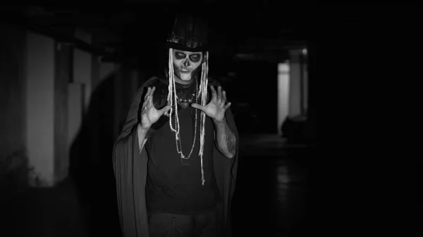 Scary man face in carnival skull Halloween makeup of skeleton looking creepy at camera on parking — Stock Photo, Image