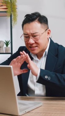 Conflict Quarrel Negotiation. Angry businessman CEO making webcam laptop online video call at office. Upset mad freelancer man talking colleague conversation analyzing financial report mistake problem
