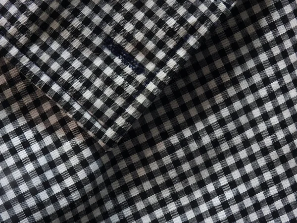 Plaid black and white shirt fabric close up