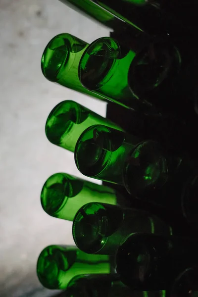 Green bottles of wine or champagne.