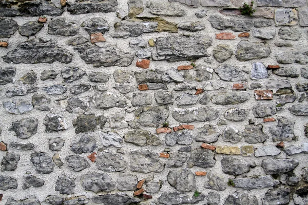 Oude veelkleurige stenen fort muur — Stockfoto