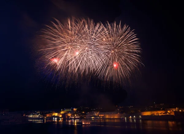Colourful fireworks in Valletta, Malta, fireworks festival 2016 in Malta, fireworks in Valletta isolated in dark background with the place for text, 4 July, Independence, New Year, explode, fireworks — Stock Photo, Image