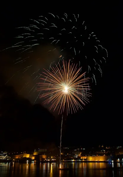 Golden orange amazing fireworks isolated in dark background close up with the place for text, Malta fireworks festival, 4 of July, Independence day, New Year, explode — Stock Photo, Image