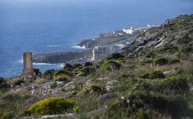 Qrendi, Malta - jan 2021: The memorial to Sir Walter Norris Congreve, English Army officer and the governor of Malta, pointed near the Megalithic temple of Mnajdra with the view to Lapsi in background