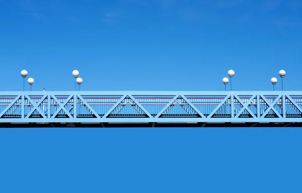 Fragment of bridges with lamps in blue sky background — ストック写真