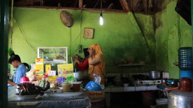 blurred image, a traditional warung atmosphere, while serving customers for meals, Pekalongan, Indonesia, January 28, 2021 clipart