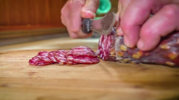 Close Shot Man Hands Cutting Thin Slices Salami Wooden Board — Stock Video