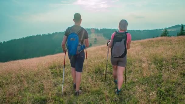 Slow Motion Shot Two Hikers Walking Together Dreamy Hill Golden — Stock Video