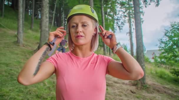 Young Woman Putting Helmet Man Waiting Her Hillside Forest — Stock Video