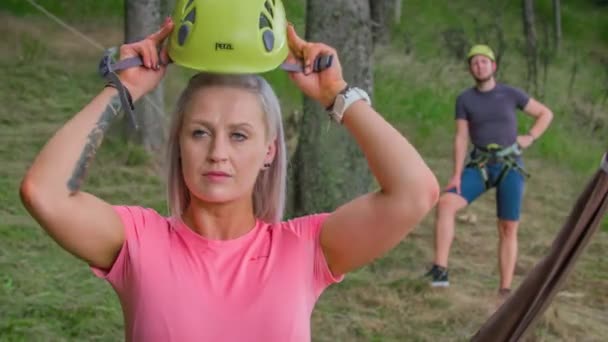 Young Woman Putting Helmet Man Waiting Her Hillside Forest Adrenalin — Stock Video