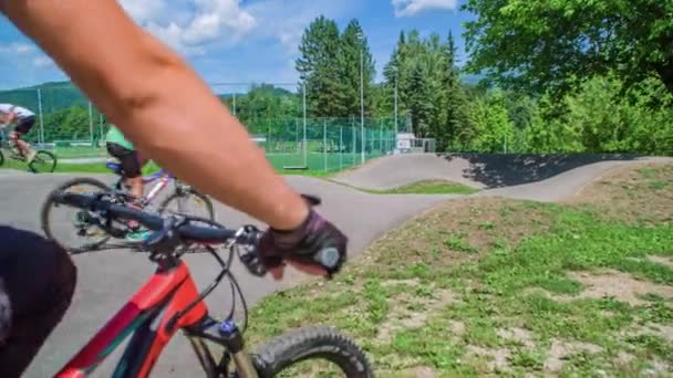 Slow Motion Person Bike Pan Right Kids Riding Bikes Pump — Stock Video