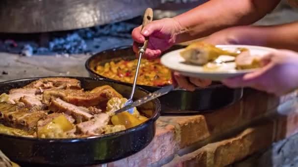 Close Shot Two Women Serving Vegetables Chicken Legs Plate Wooden — Stock Video