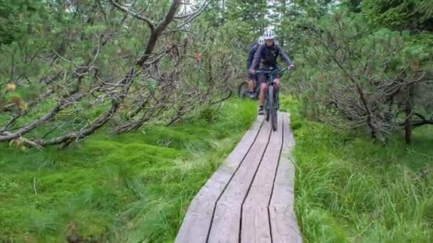 Slowmotion Shot Girl Boy Mountain Biking Wooden Path Green Nature — Stock Video