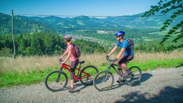 Couple Stops Cycling Enjoy Beautiful View Slide Shot Right Left — Stock Video