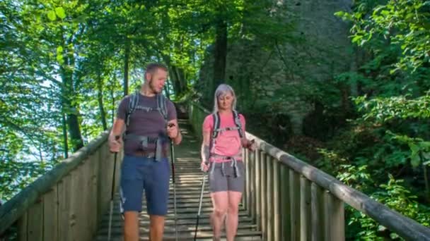 Boy Girl Walking Camera Wooden Bridge Beautiful Sunny Day Green — Stock Video