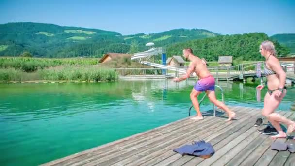 Couple Running Jumping Outdoor Pool Slow Motion — Stock Video