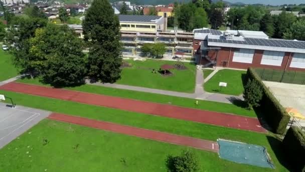 View on school with spacious playground — Stock Video