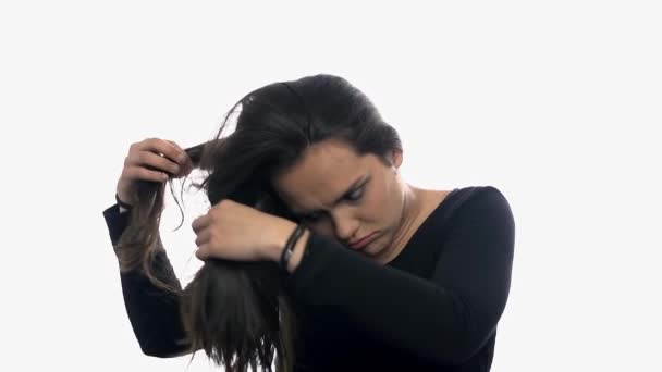 Depressed woman touching hair. — Stock Video