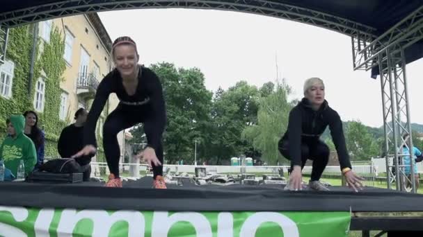 Girls doing push ups and jumps on stage — Stock Video