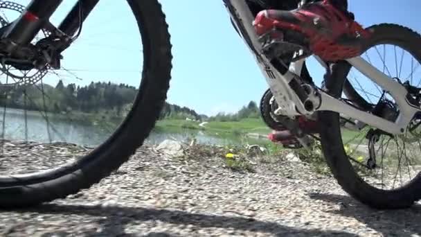 Downhill driver pedaling bicycle — Stock Video