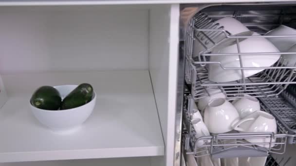 Closing the dishwasher on kitchen — Stock Video