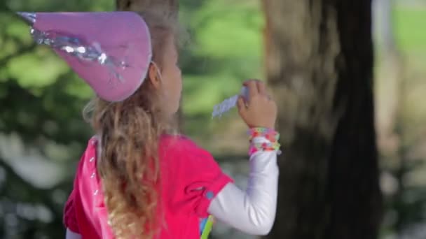 Young cute girl blowing the bubbles — Stock Video